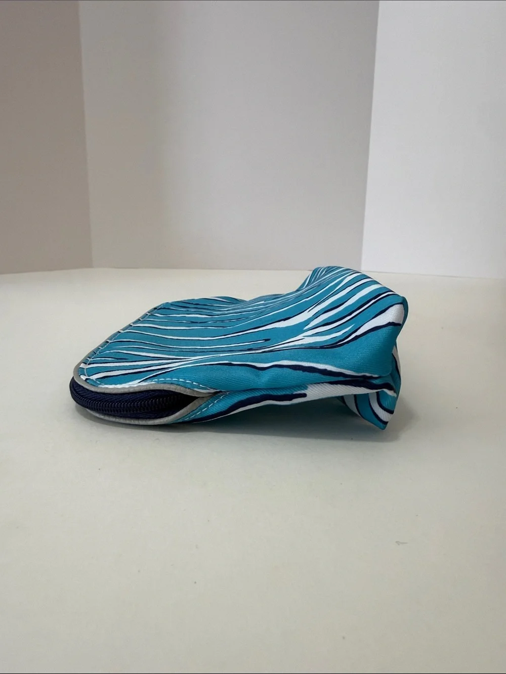 Estee Lauder Turquoise and White Zebra-Print Cosmetic Pouch with Lion Charm